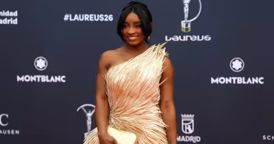 Simone Biles says she was hospitalized after ‘almost dying’ and is recovering at home