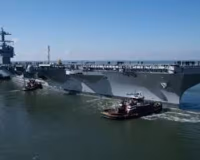 Navy says sailor confined after death aboard Uss John F Kennedy