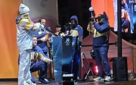 Olympic Flame Ignites in Udine as Hundreds Gather in Rain at Piazza Libertà