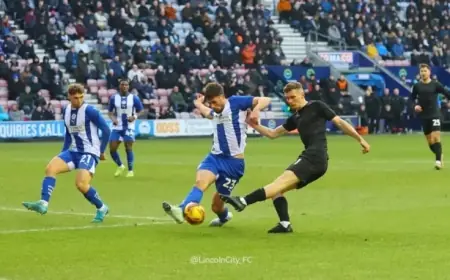 Wigan Athletic Competes with League One Rivals for Defender