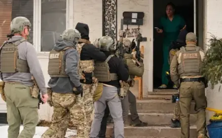 ICE Agents Deploy Military-Grade Weapons at Minnesota Homes