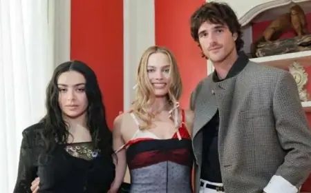 Margot Robbie Stuns in Markgong Sheer Illusion Dress with Layered Bras