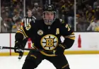 Bruins Defenseman Exits Ice Injured After Head Elbow Incident