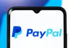 Stripe headlines collide with a site verification prompt as readers try to follow the PayPal story