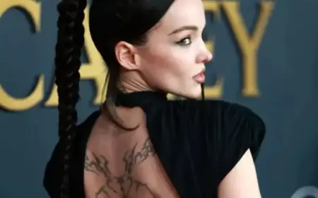 Dove Cameron Showcases Tattoos in Elegant Black Dress at MusiCares Event