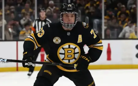 Bruins Defenseman Exits Ice Injured After Head Elbow Incident