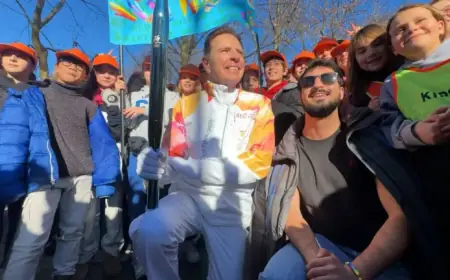 Fraser Bullock Lights Olympic Torch in Milan, Inspires Thousands of Students