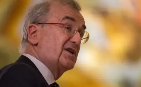 French Central Bank Chief’s Sudden Exit Fuels Suspicion Among Macron Opponents