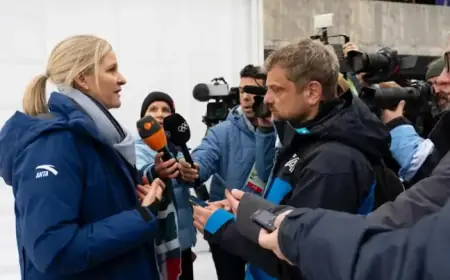 IOC President Kirsty Coventry Discusses With Ukrainian Skeleton Pilot Vladyslav Heraskevych