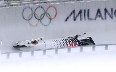 Bobsleigh Crash Leaves Austrian Pilot Stretchered Off and Forces Long Delay at Milano Cortina