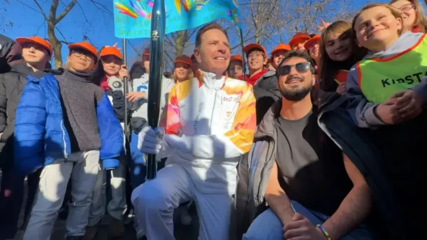 Fraser Bullock Lights Olympic Torch in Milan, Inspires Thousands of Students