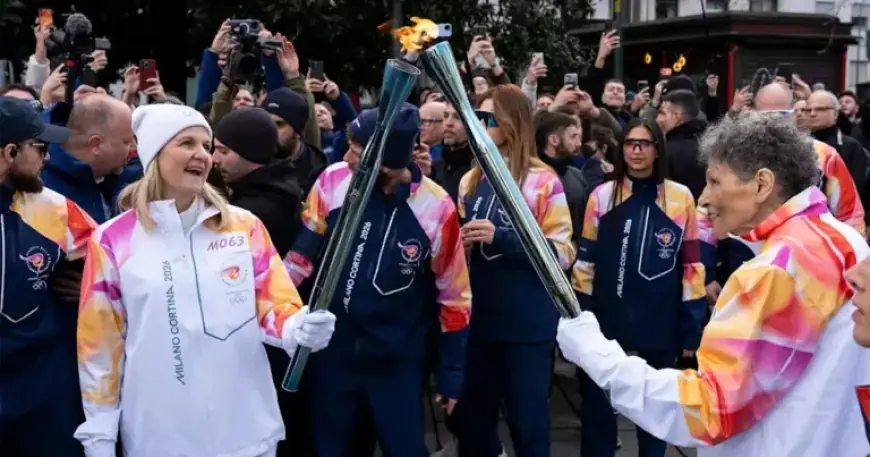 Anita DeFrantz Passes Olympic Torch to IOC Chief Kirsty Coventry