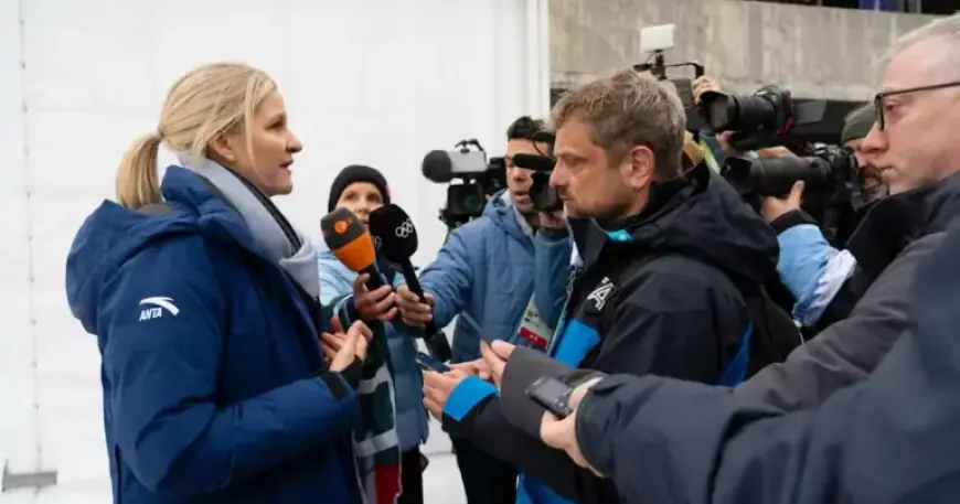 IOC President Kirsty Coventry Discusses With Ukrainian Skeleton Pilot Vladyslav Heraskevych
