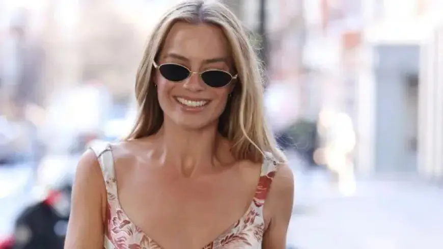 Margot Robbie Shines in Sheer Fishnet Minidress at Premiere