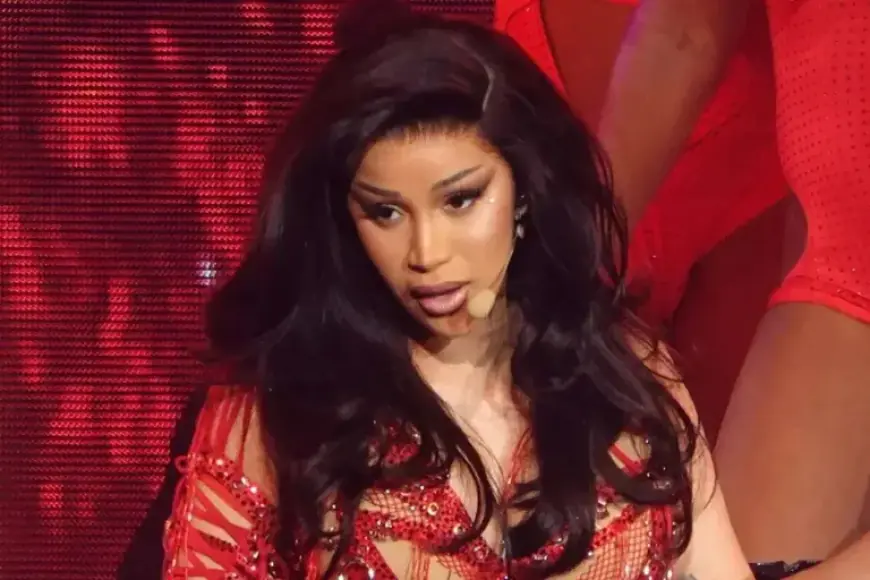 Cardi B Jokingly Blames Government After Falling Off Chair at Concert