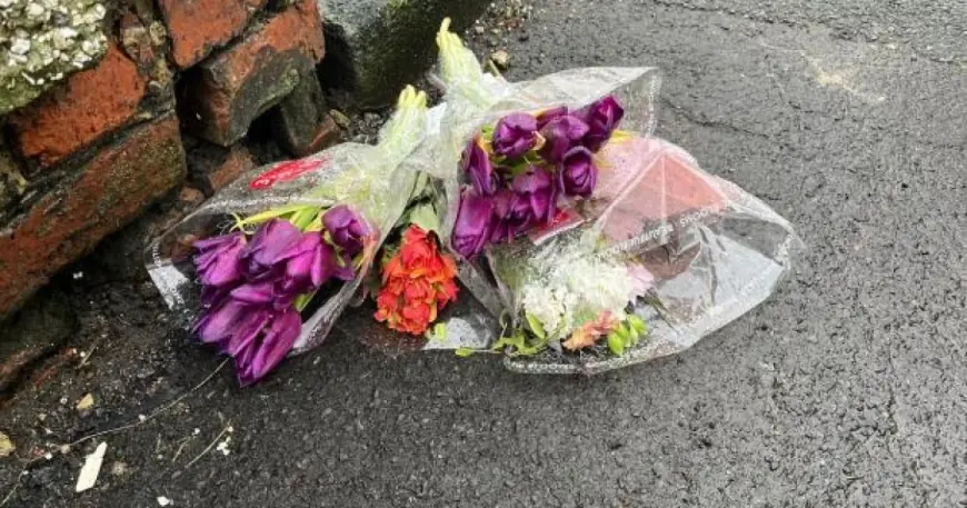 Floral tributes and heavy cordon in horden as CSI examines alleyway