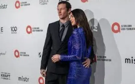 Dua Lipa Sends Pulses Racing in Plunging Blue Dress at Elton John’s Oscars Party