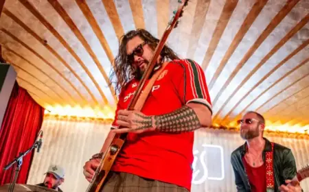 Jason Momoa Joins Adria Arjona Onstage in Surprise Band Performance