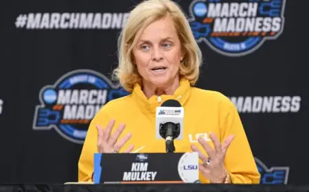 LSU’s Kim Mulkey Dazzles in Shimmery Purple at Sweet 16 vs. Duke