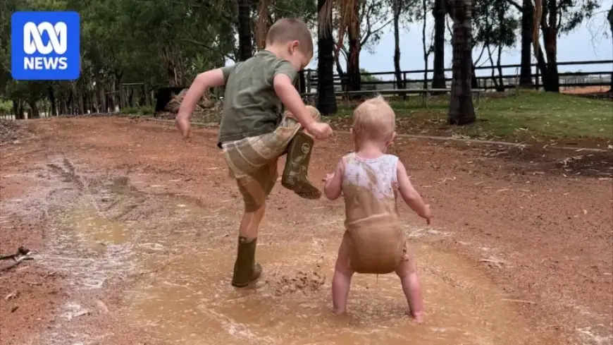 Children Experience Joy of Puddle Jumping After Drought Ends