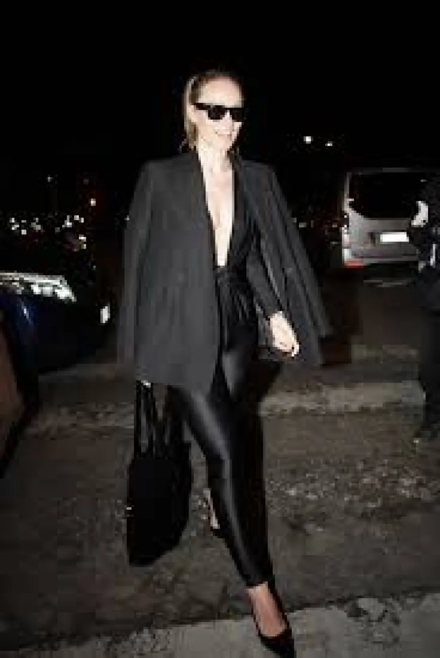 Olivia Wilde Stuns in Plunging Black Catsuit That Dips to Her Stomach During Paris Fashion Week Night Out