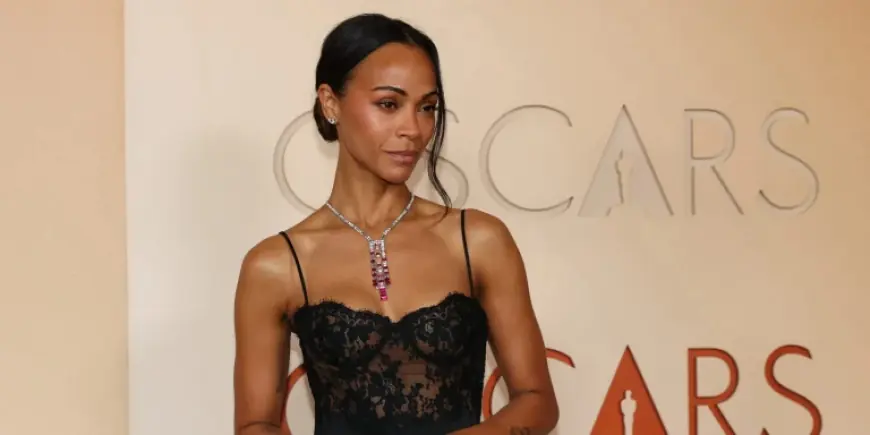Zoe Saldana Wears a Lingerie-Inspired Gown at the 2026 Oscars, Returning as Presenter