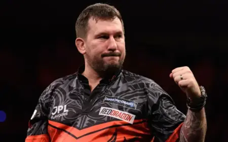 Jonny Clayton Defeats Luke Littler, Secures Top Spot in Premier League Darts