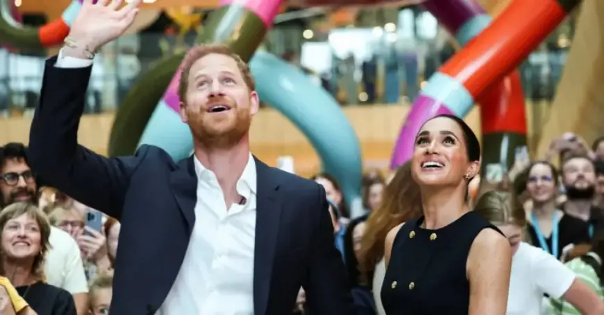 Prince Harry and Meghan Receive Subdued Reception Upon Australia Arrival